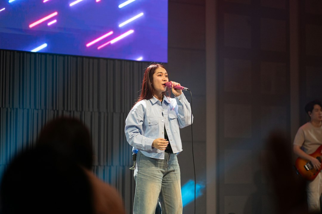 person speaking on stage confidently